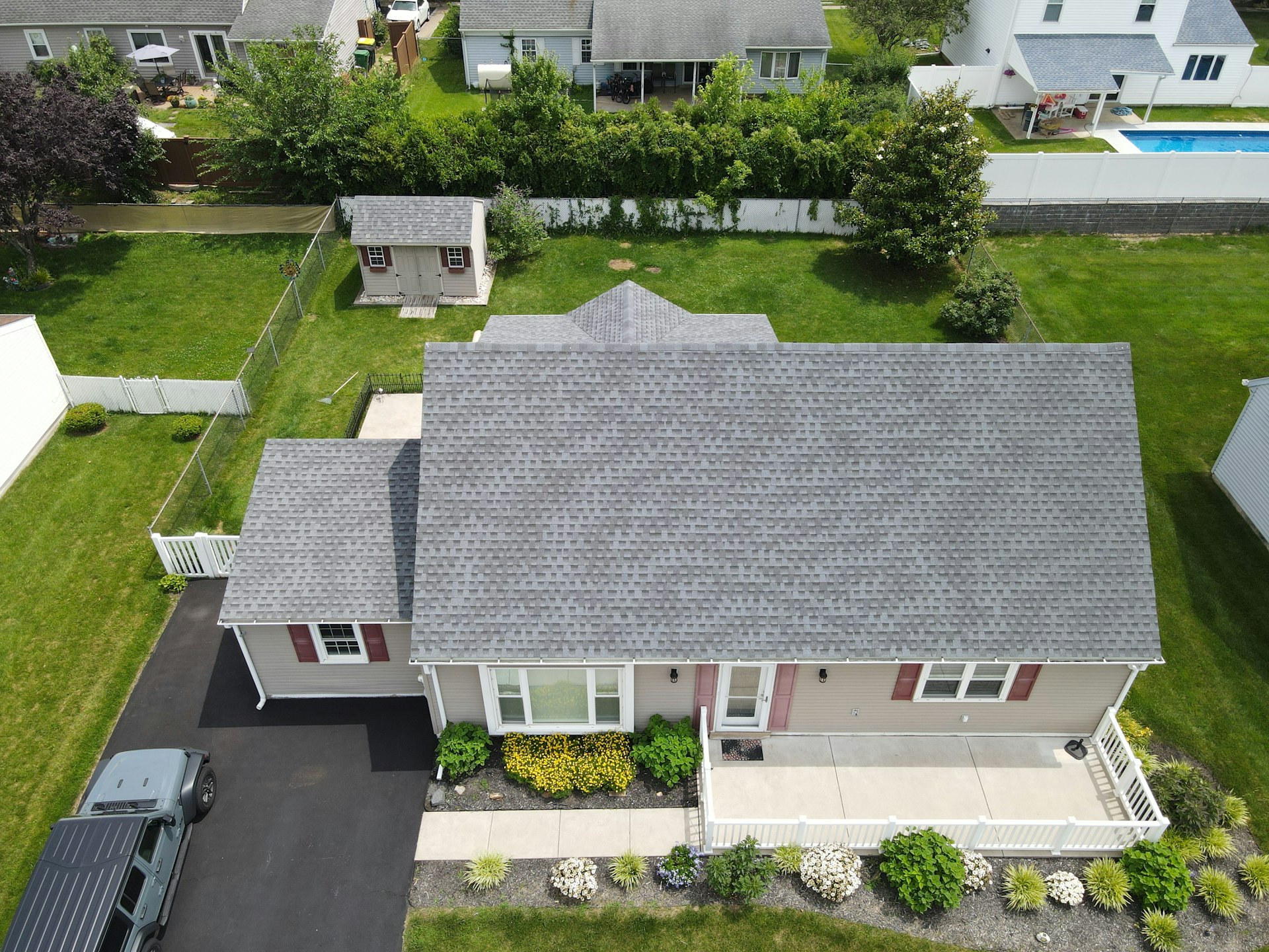 Aerial view of a freshly shingled residential roof